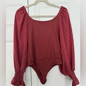 Deep pink bodysuit with flowy sleeves. NWOT.